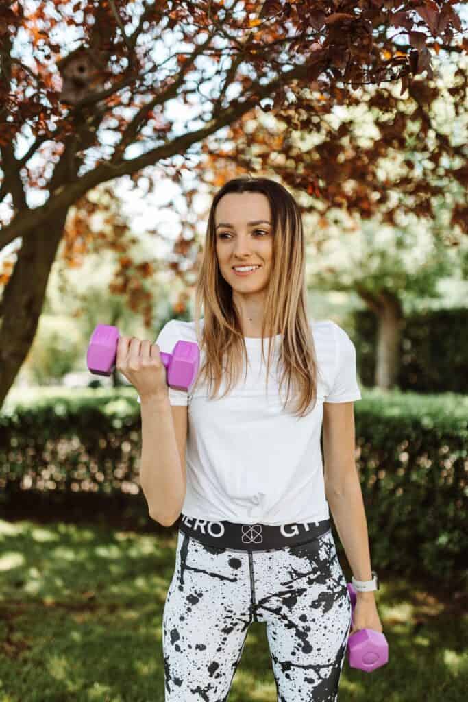 Beginner performing a strength training exercise with light dumbbells