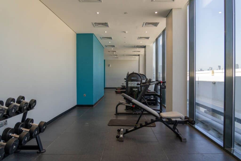 Gym space with both cardio machines and strength training equipment