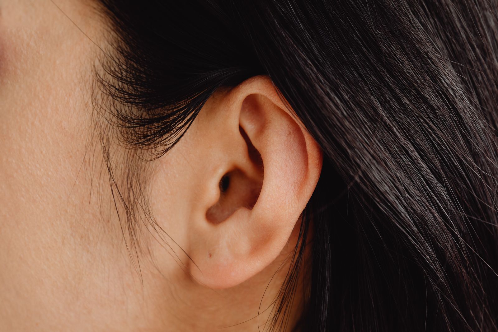 A detailed close-up photo showcasing a human ear