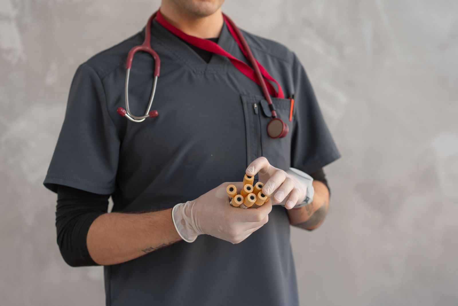 A doctor holding blood test tubes, used to check vitamin B12 levels