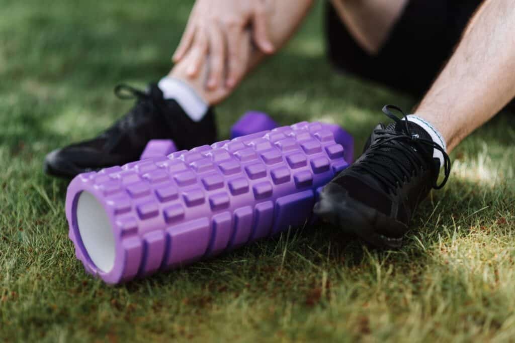Person stretching to relieve muscle soreness after a workout
