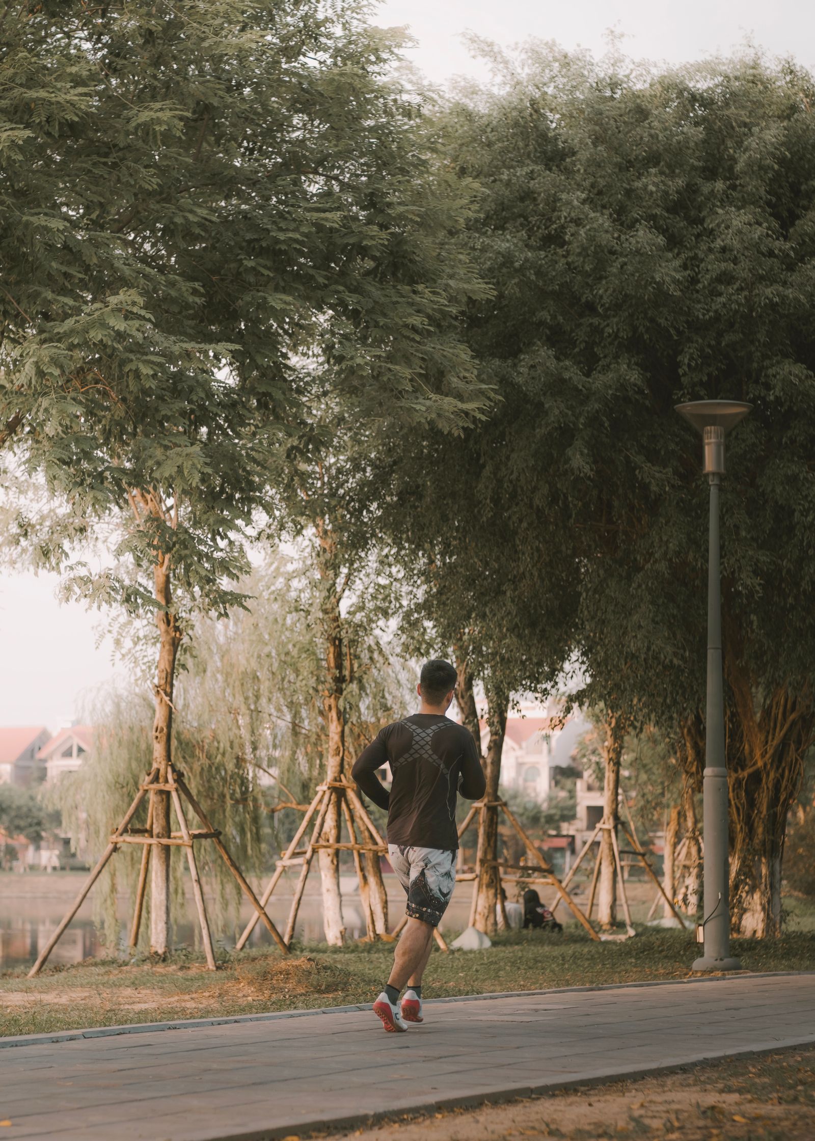 A man jogging in an urban park