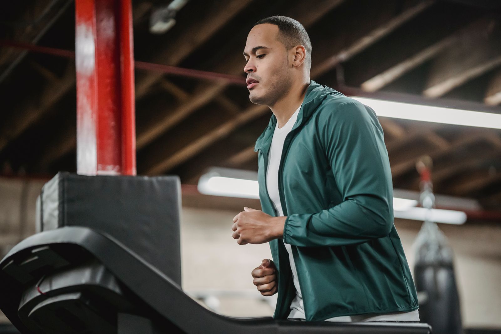 A man running on a treadmill, returning to regular training