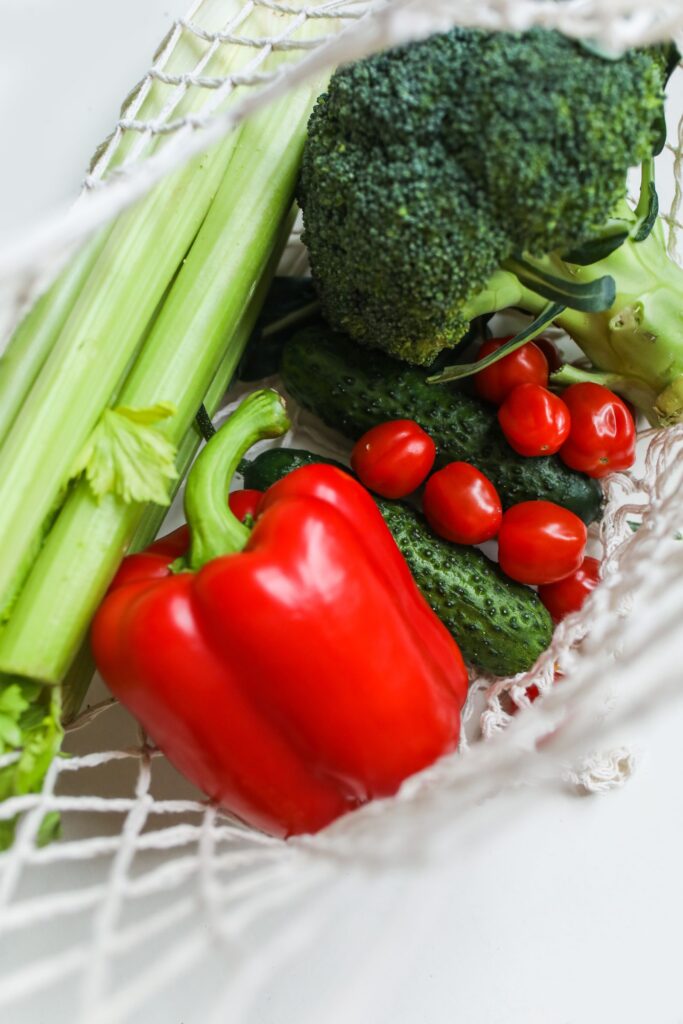A mix of fresh vegetables including broccoli, peppers, and cucumbers, good sources of dietary fiber