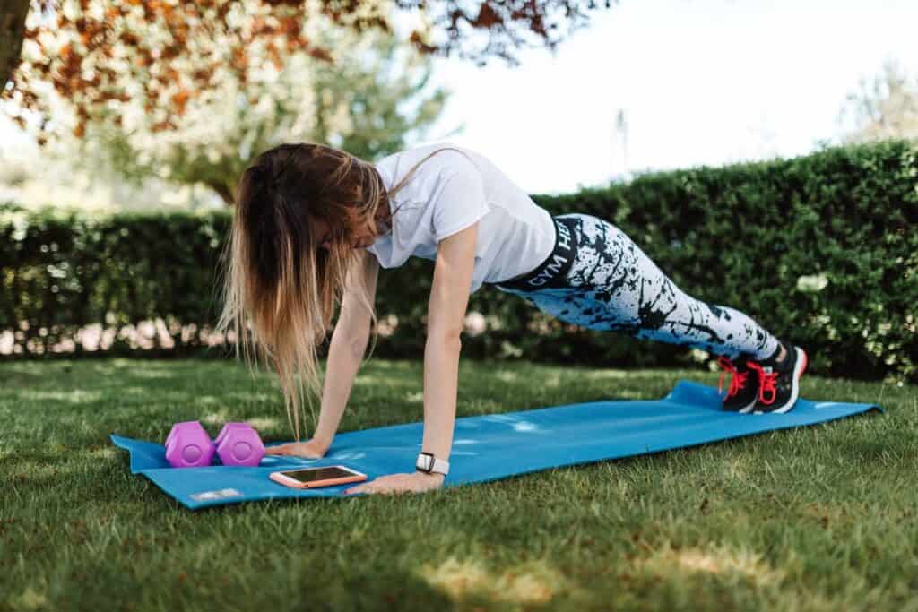 Person doing a no-equipment bodyweight workout at home