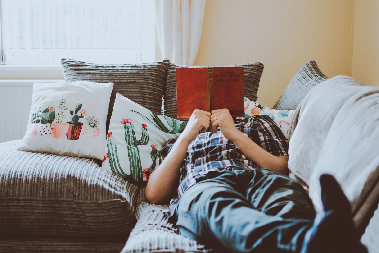 A person relaxing on a sofa during a break from exercise