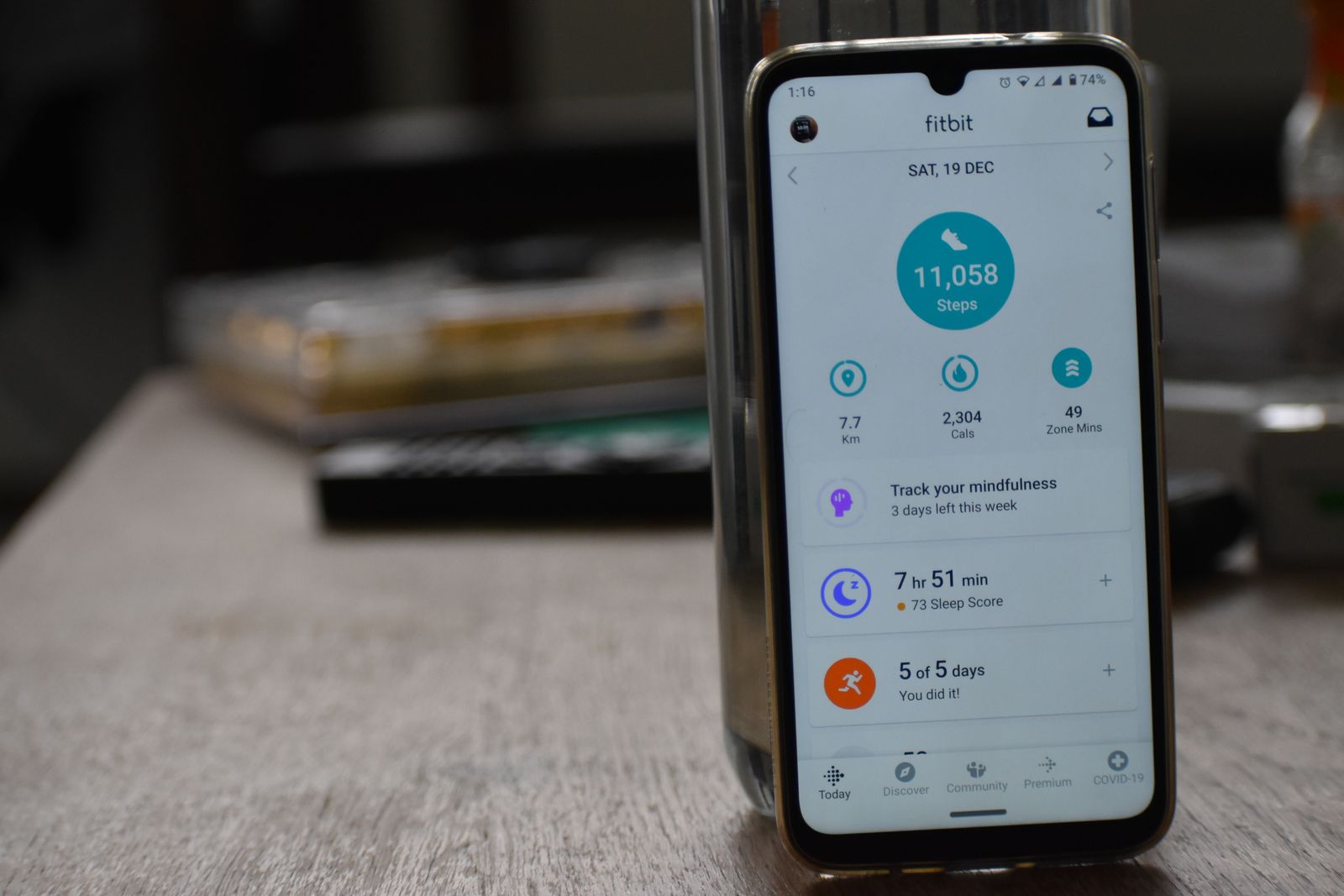 A smartphone displaying a fitness tracking app with step count statistics