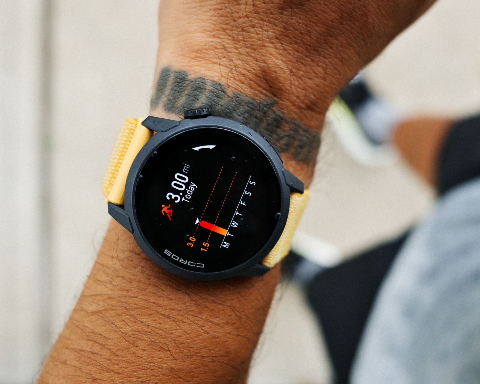 Close-up of a smartwatch tracking heart rate on a runner’s wrist