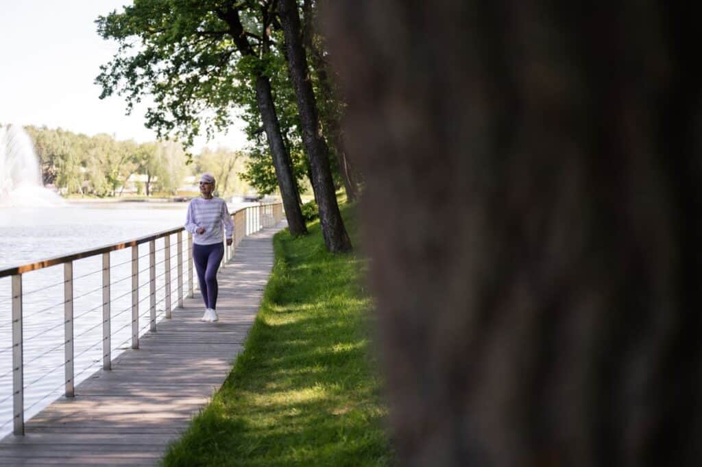 Person walking outdoors for exercise and health benefits