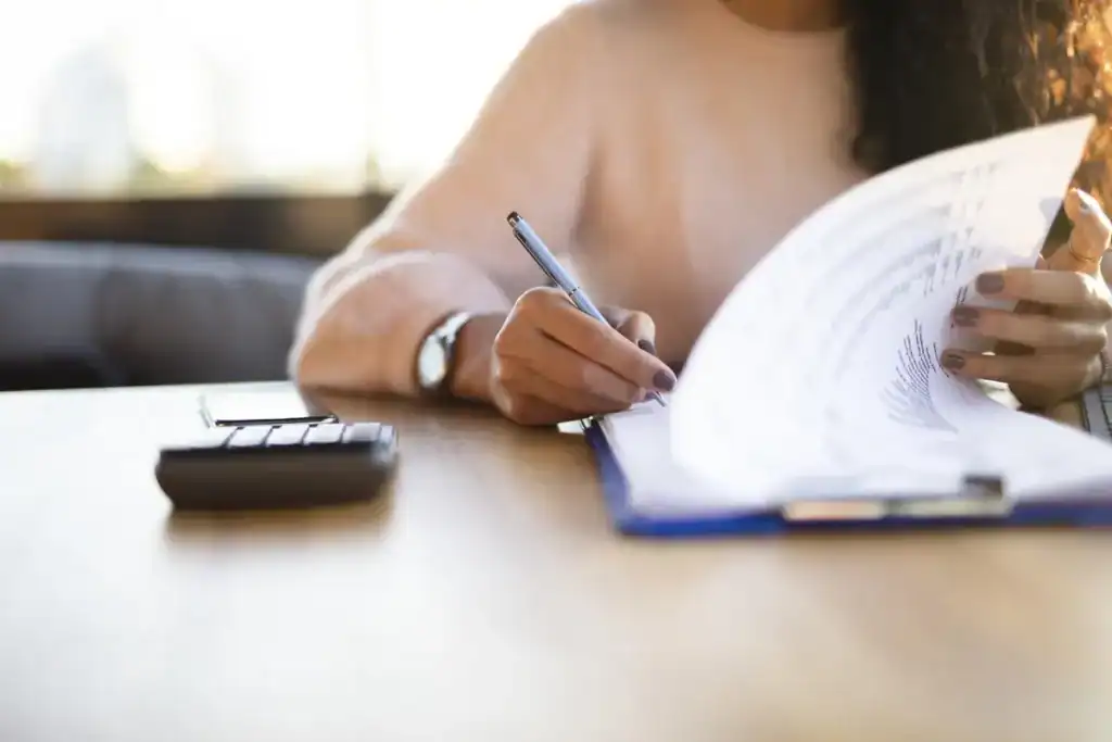 Person reviewing health insurance paperwork and documents