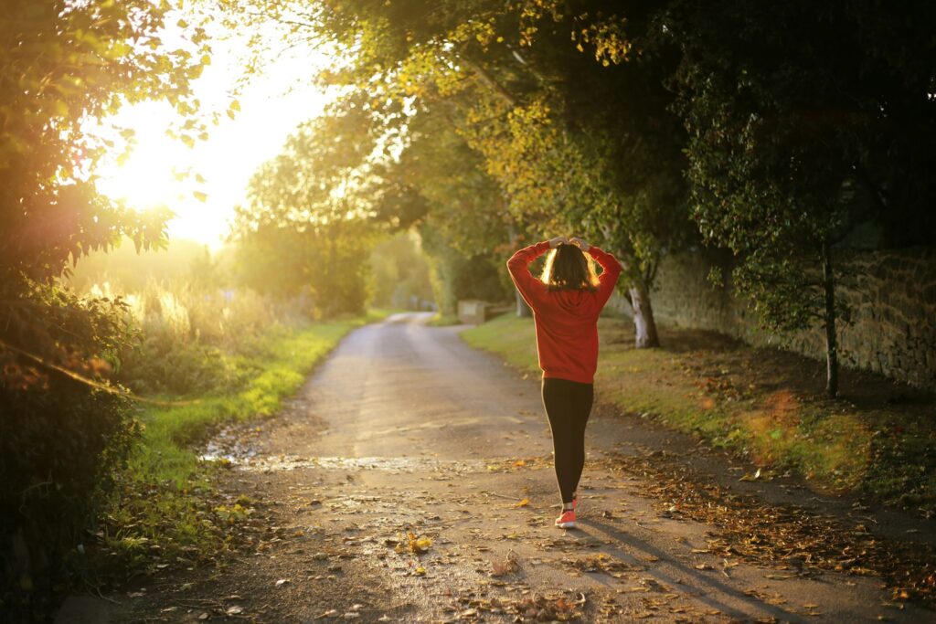 A woman walking outdoors as part of a daily lifestyle routine